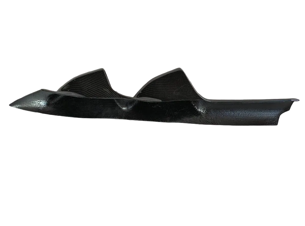 Carbon fiber winglet on a textured white background