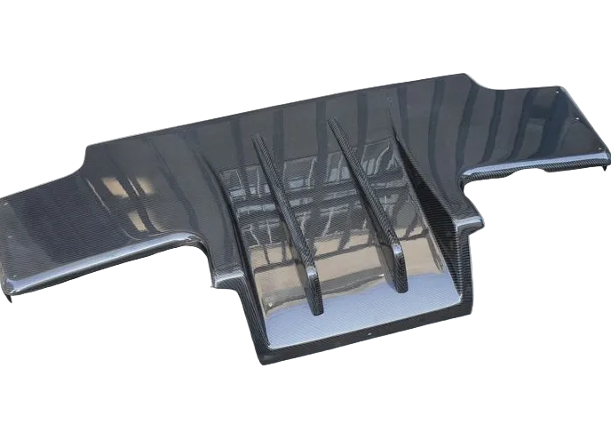 Carbon fiber car part on a concrete surface