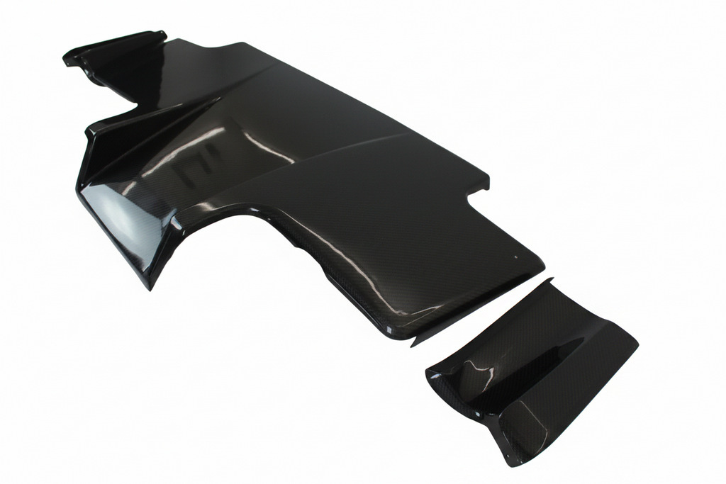 Black car body panel on a white floor